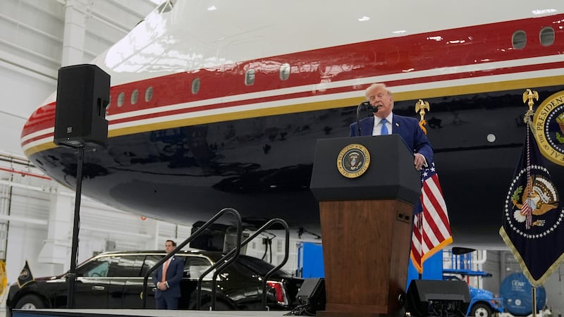 President Donald Trump speaks after touring the newly designated Air Force One presidential...