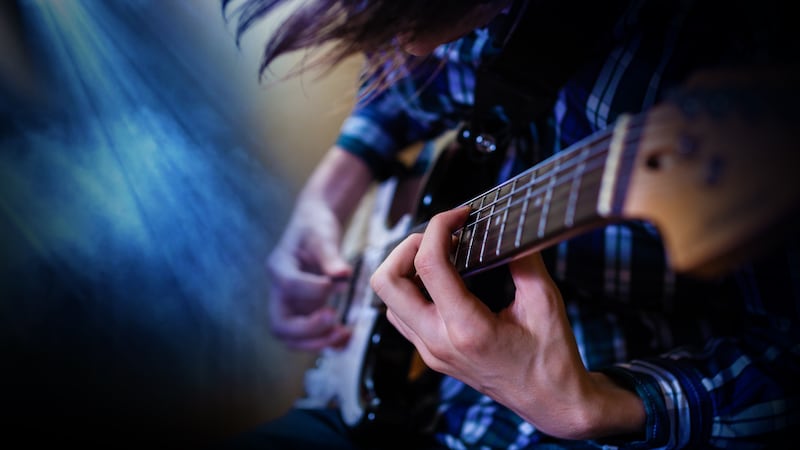 File photo of an artist playing an electric guitar