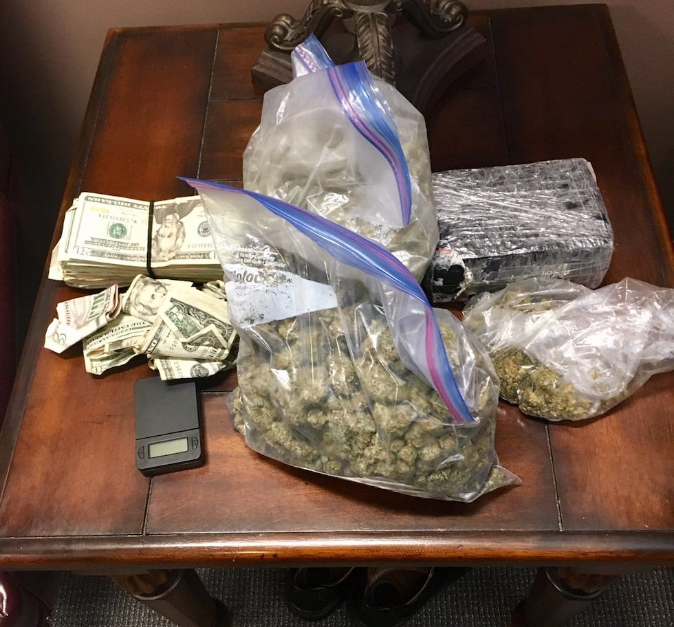detectives seized 2.8 pounds of Marijuana, 14 bags of synthetic Marijuana, plastic baggies,...